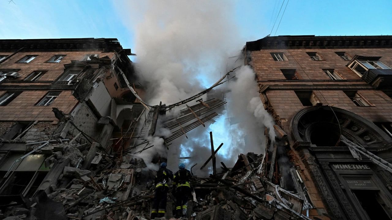 Rescuers work at a residential building which was heavily damaged by a Russian missile strike in Zaporizhzhia. Credit: Reuters Photo