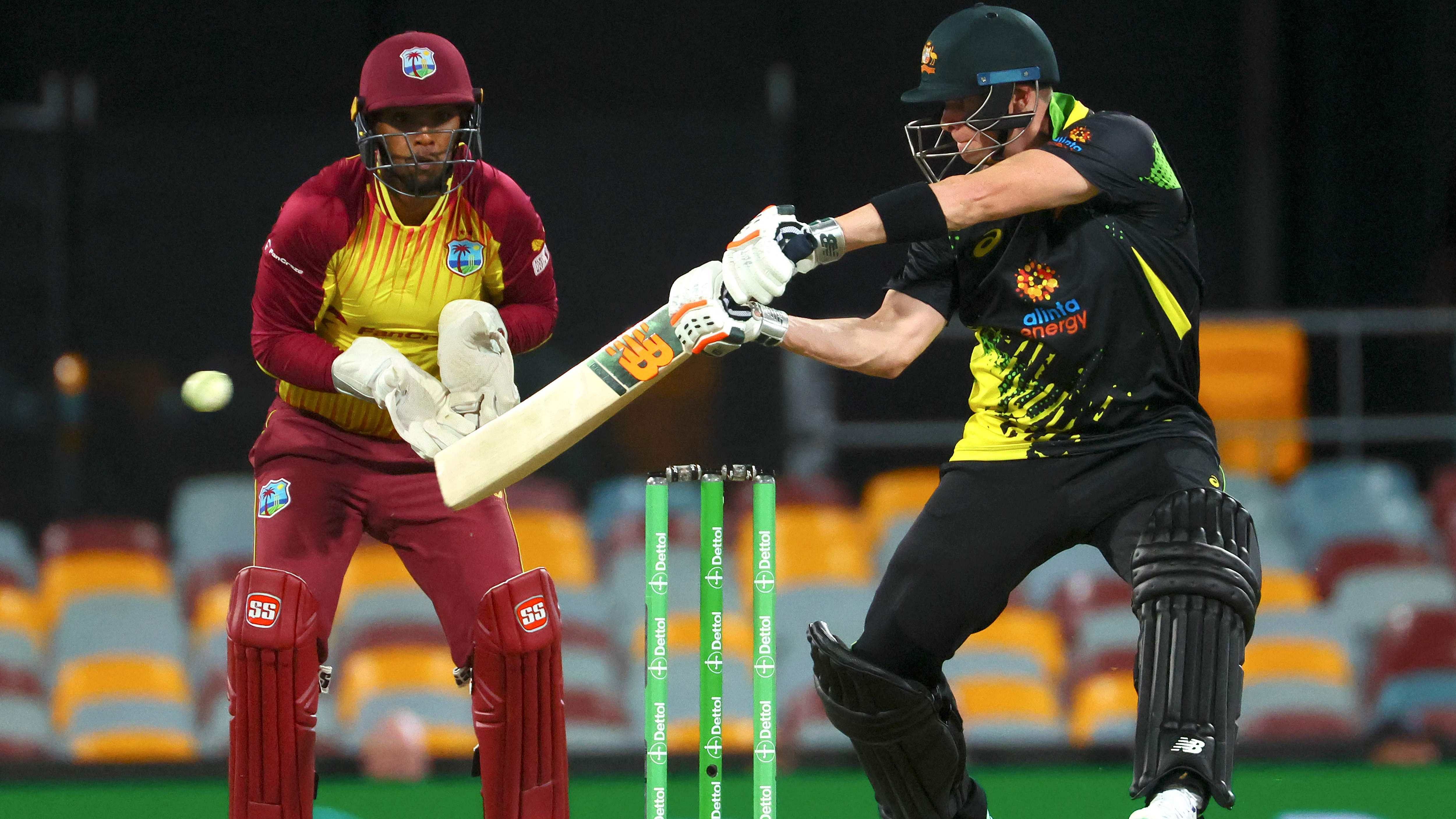 Australia's Steve Smith plays a shot watched by the West Indies wicketkeeper Nicholas Pooran. Credit: AFP Photo