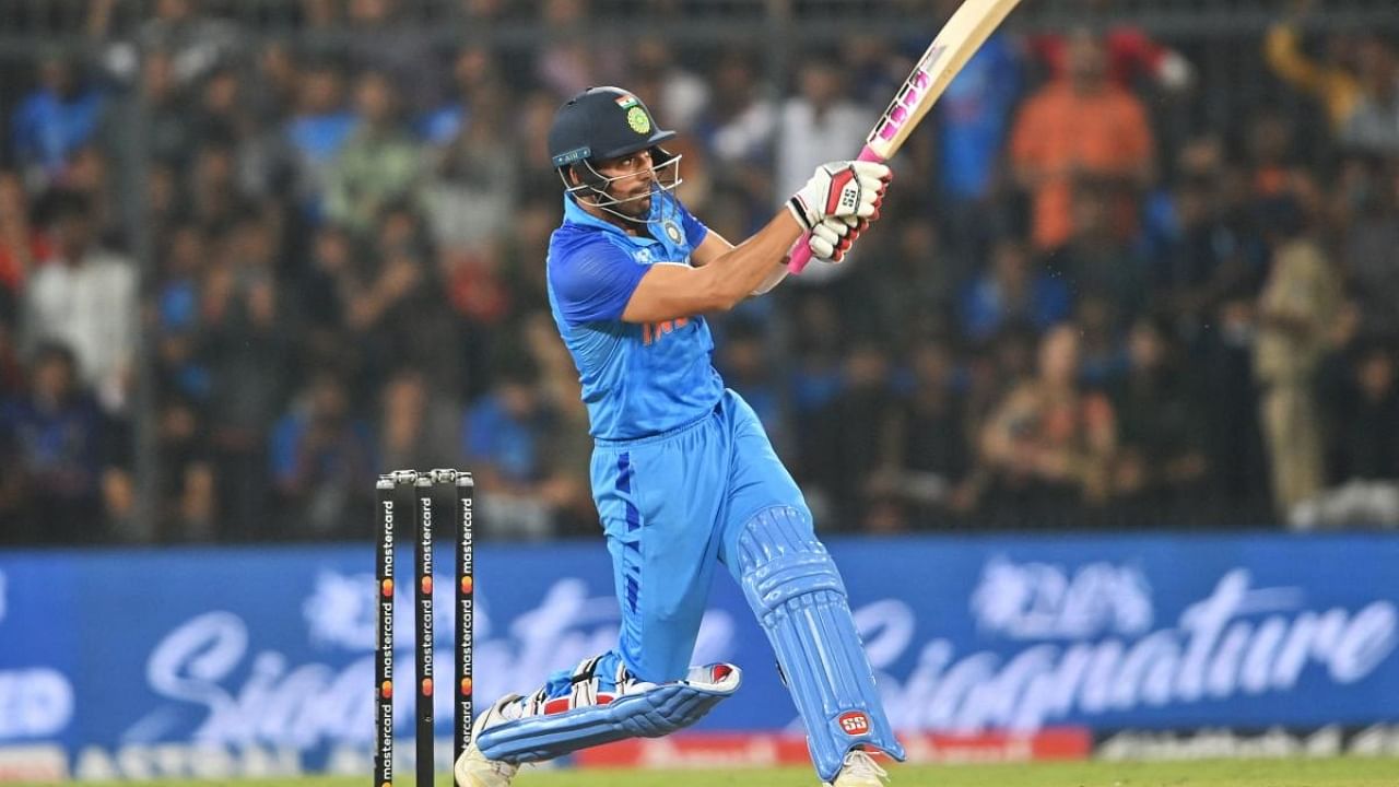 Deepak Chahar plays a shot during the third and final Twenty20 international cricket match between India and South Africa at the Holkar Cricket stadium in Indore on October 4, 2022. Credit: AFP Photo