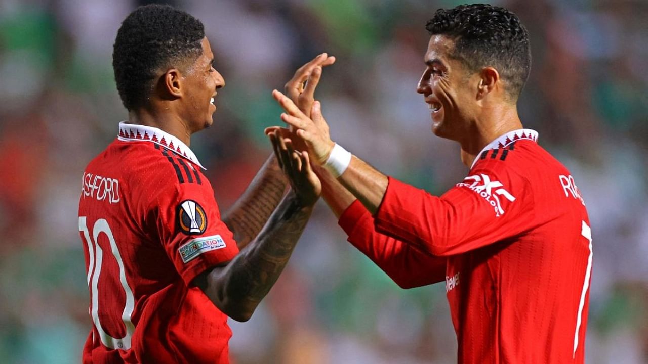 Manchester United's Cristiano Ronaldo and Marcus Rashford celebrate together during the UEFA Europa League match between Cyprus' Omonia Nicosia and England's Manchester United at GSP stadium in the capital Nicosia. Credit: AFP Photo
