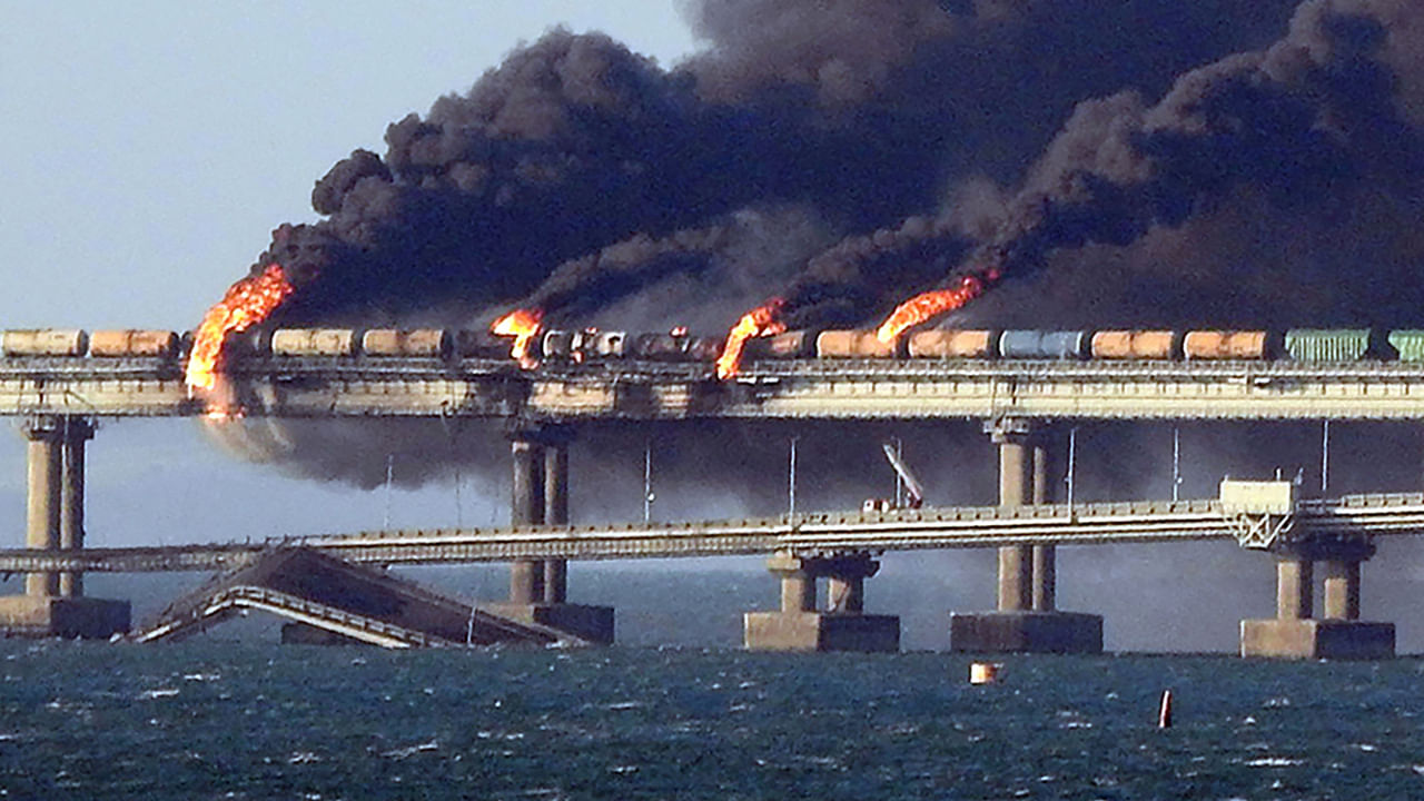 Black smoke billows from a fire on the Kerch bridge that links Crimea to Russia, after a truck exploded, near Kerch. Credit: AFP Photo