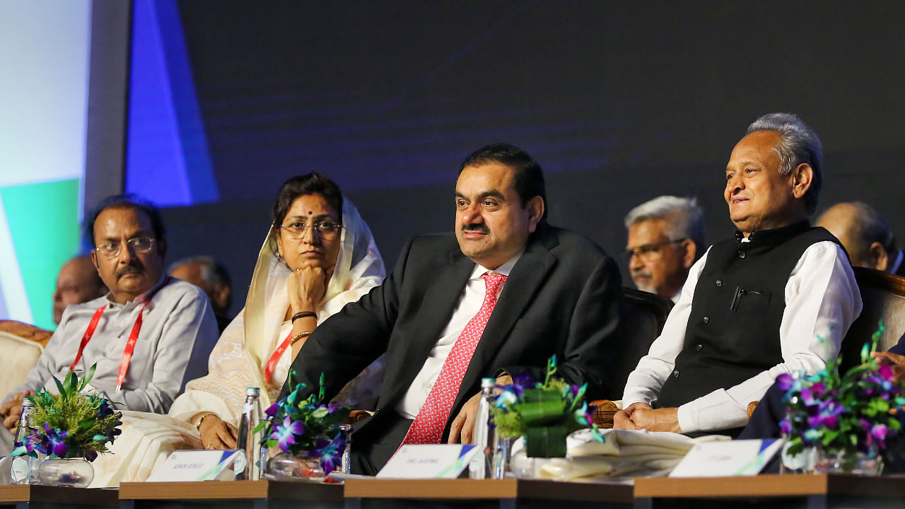 Rajashtan CM Ashok Gehlot, Adani Group Chairman Gautam Adani and Congress leader Shakuntala Rawat during the Invest Rajasthan Summit 2022, in Jaipur, Friday, Oct. 7, 2022. Credit: PTI Photo