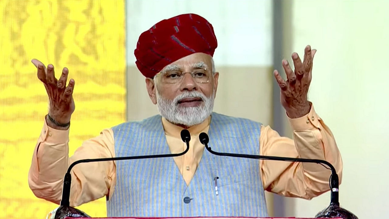 Prime Minister Narendra Modi speaks during a ceremony to lay the foundation stone & dedicate development works at Modhera village in Mehsana district, Sunday, Oct. 9, 2022. Credit: PTI Photo