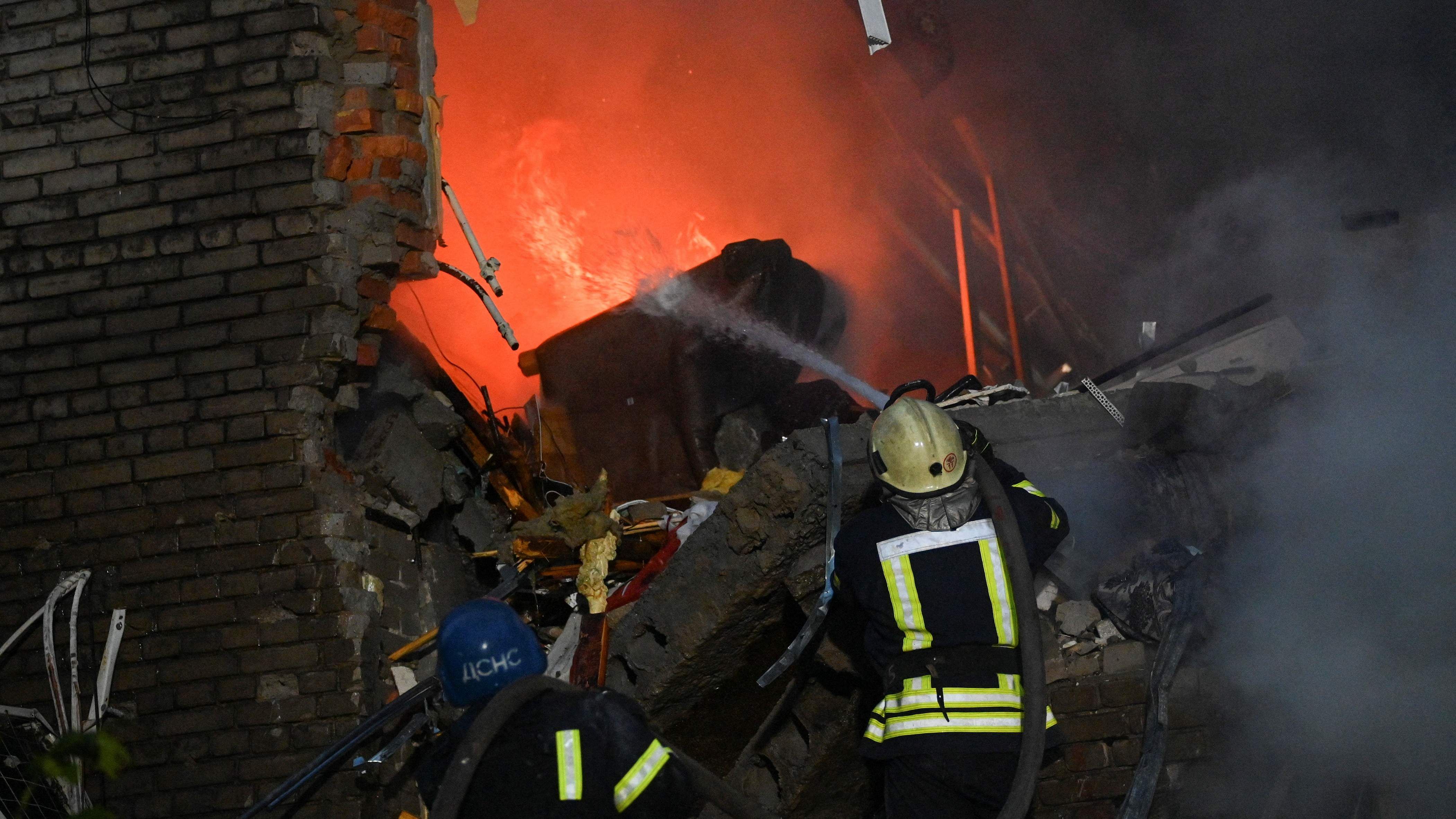 Rescuers work at a site of a residential building heavily damaged by a Russian missile strike. Credit: Reuters Photo