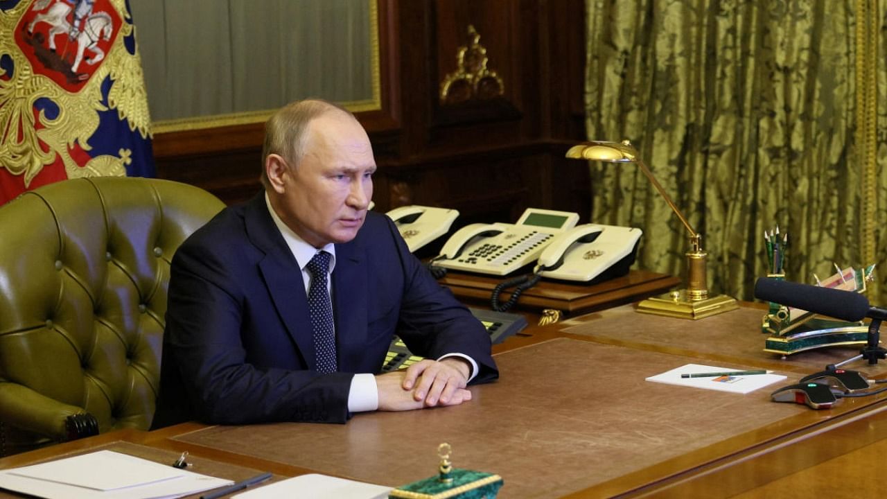 Russian President Vladimir Putin attends a meeting with members of the Security Council via a video link in Saint Petersburg. Credit: Reuters photo
