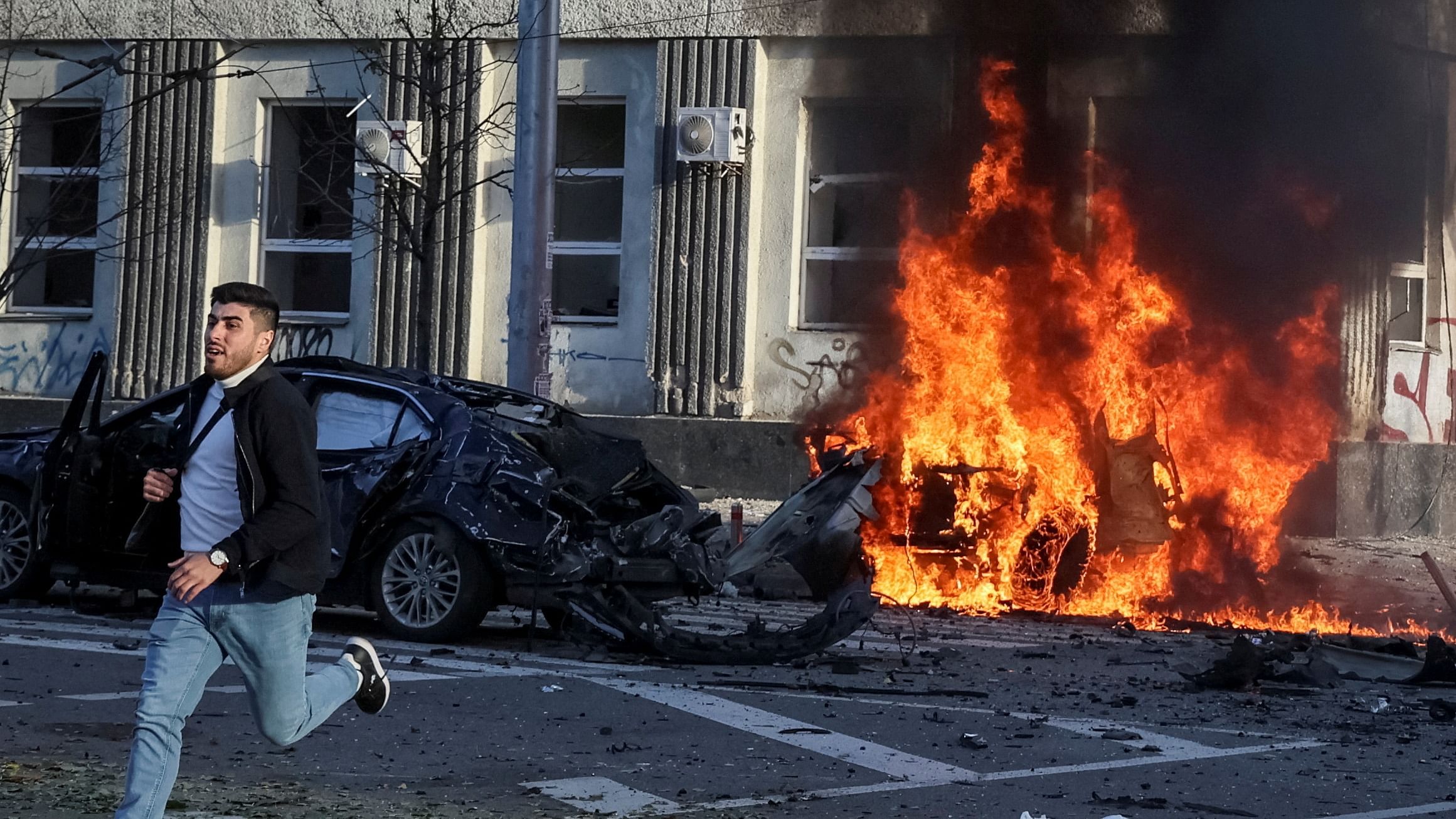 Cars burn after Russian military strike, as Russia's invasion of Ukraine continues, in central Kyiv, Ukraine. Credit: Reuters Photo