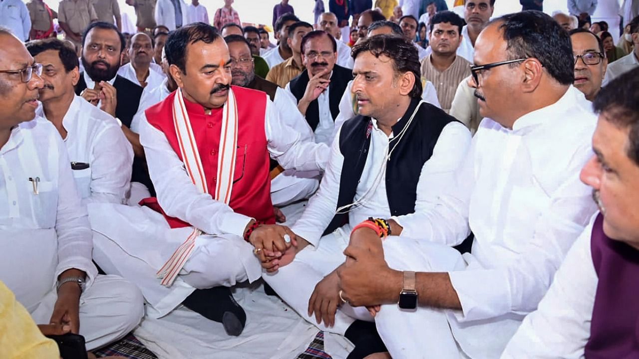 Uttar Pradesh Deputy Chief Ministers Brajesh Pathak and Keshav Prasad Maurya offer condolences to Samajwadi Party President Akhilesh Yadav during the funeral of his father and party founder Mulayam Singh Yadav, at Saifai in Etawah district. Credit: PTI Photo