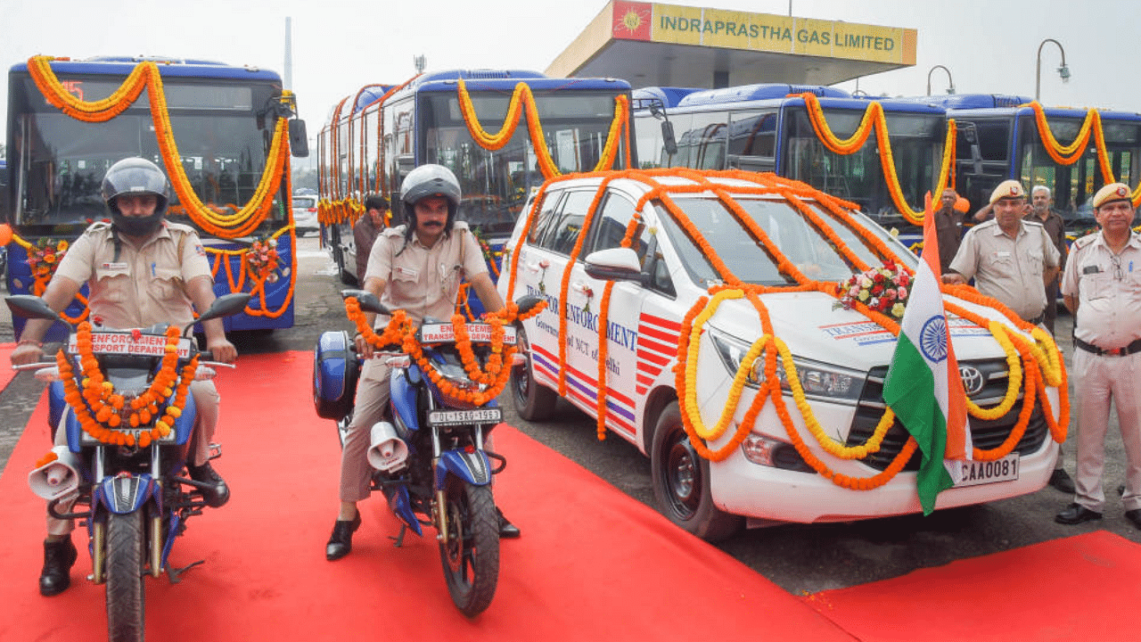 Event where Delhi government flagged off 66 new vehicles for road safety and bus lane enforcement. Credit: PTI Photo