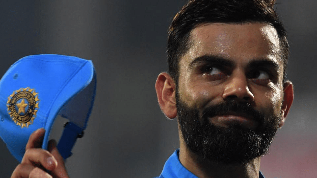 Virat Kohli gestures while fielding during the second Twenty20 international cricket match between India and South Africa. Credit: AFP Photo