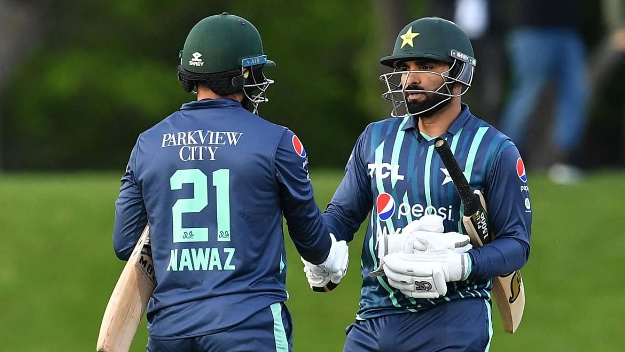 Pakistan's Mohammad Nawaz (L) and Asif Ali congratulate each other after their win during the Twenty20 tri-series cricket match between Pakistan and Bangladesh at Hagley Oval in Christchurch. Credit: AFP Photo