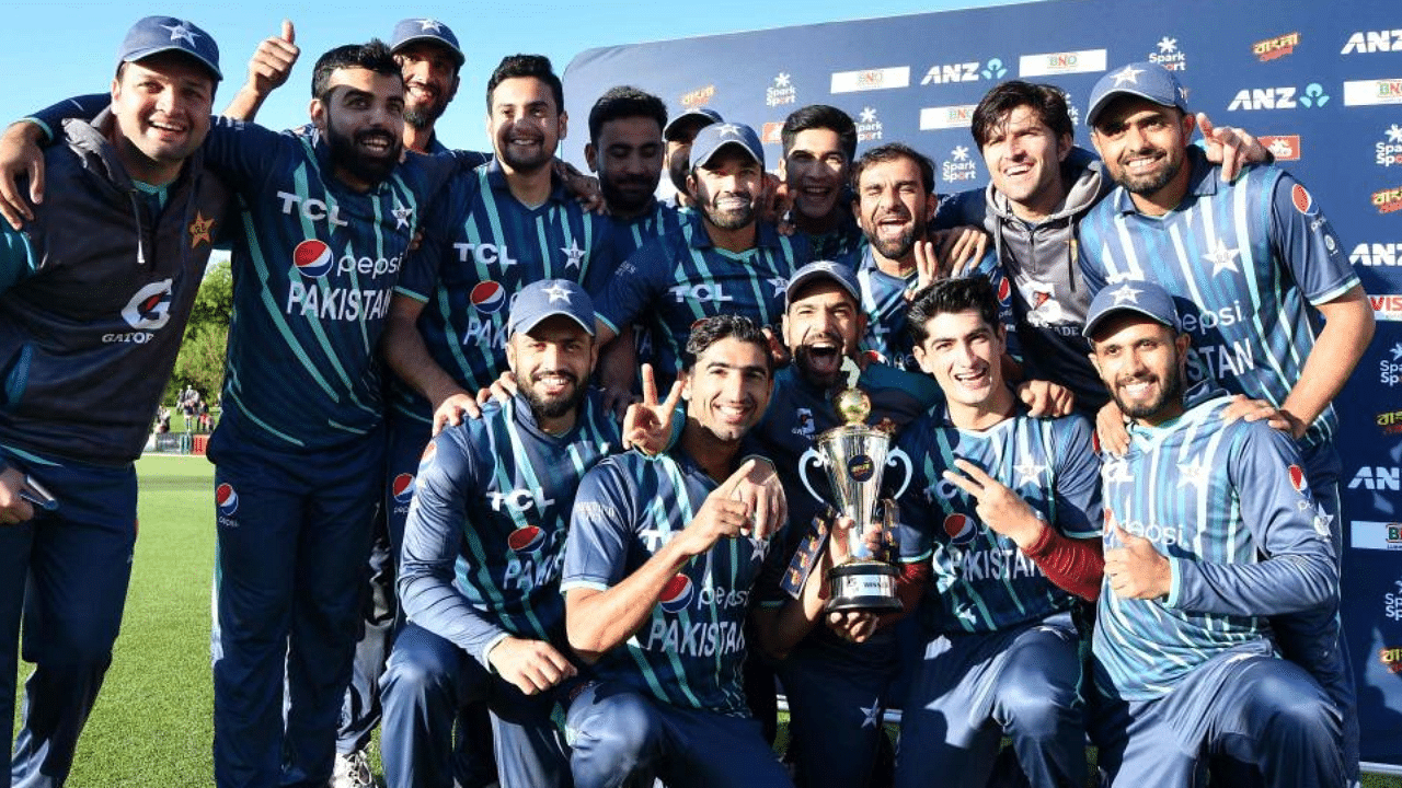 Pakistan's team pose with the trophy after winning the Twenty20 tri-series final cricket match against New Zealand. Credit: AFP Photo