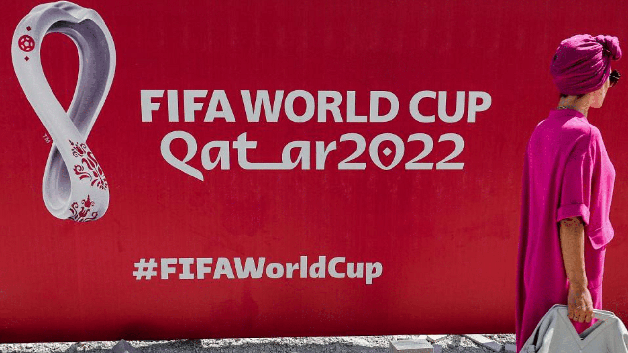 A construction site fence showing the Qatar 2022 FIFA World Cup logo in West Bay in Qatar's capital Doha. Credit: AFP Photo