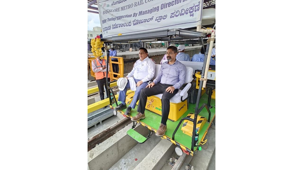 BMRCL Managing Director Anjum Parwez (R) and Director (RSE and O&M) N M Dhoke inspect a part of the metro line to Whitefield on Thursday. Credit: BMRCL