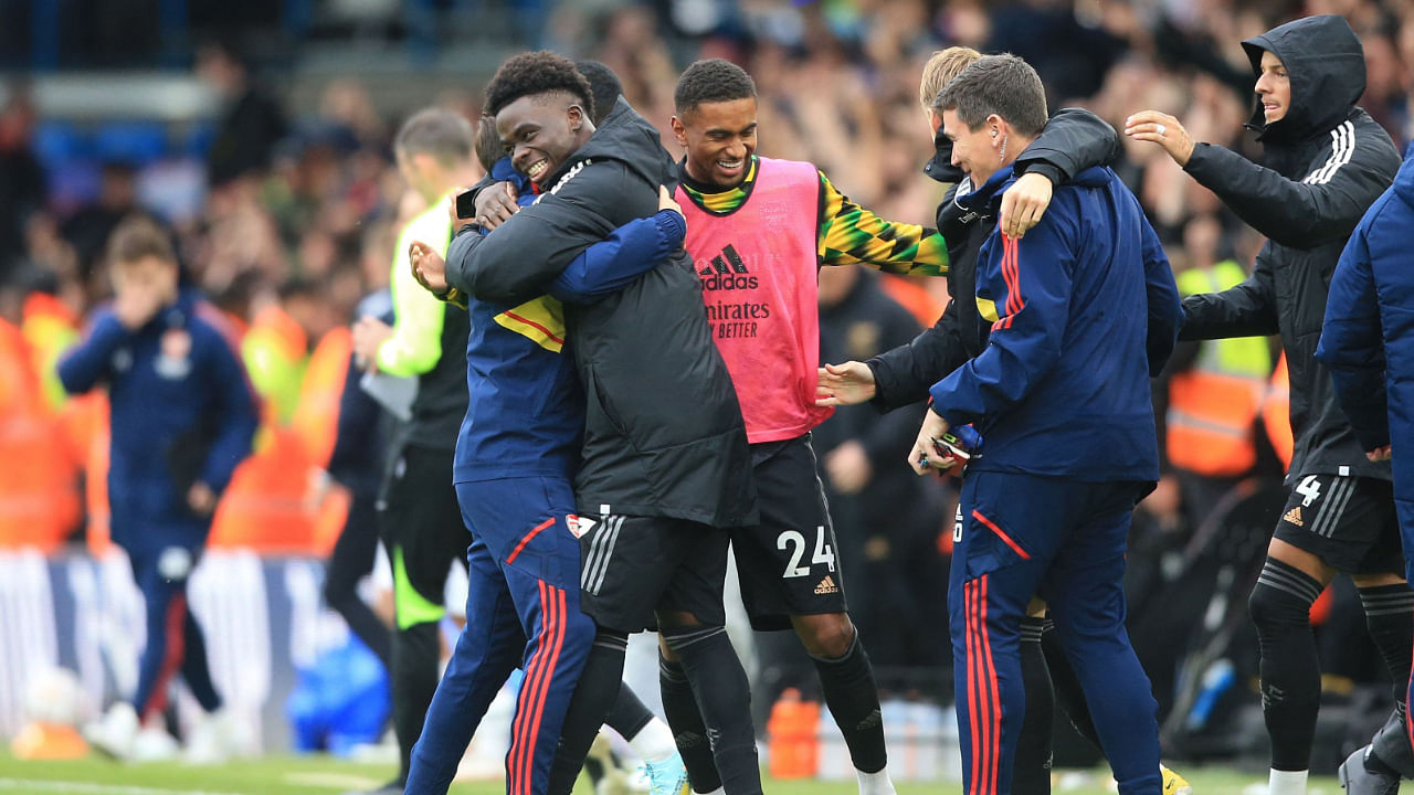 Arsenal's English midfielder Bukayo Saka (C) celebrates with teammates on the pitch after the English Premier League football match between Leeds United and Arsenal at Elland Road in Leeds, northern England. Credit: AFP Photo