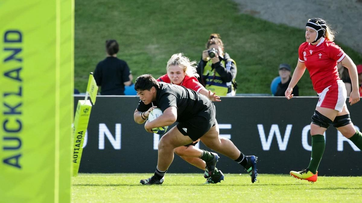 New Zealand's Krystal Murray scores a try during the Women's Rugby World Cup Pool C match. Credit: AFP Photo