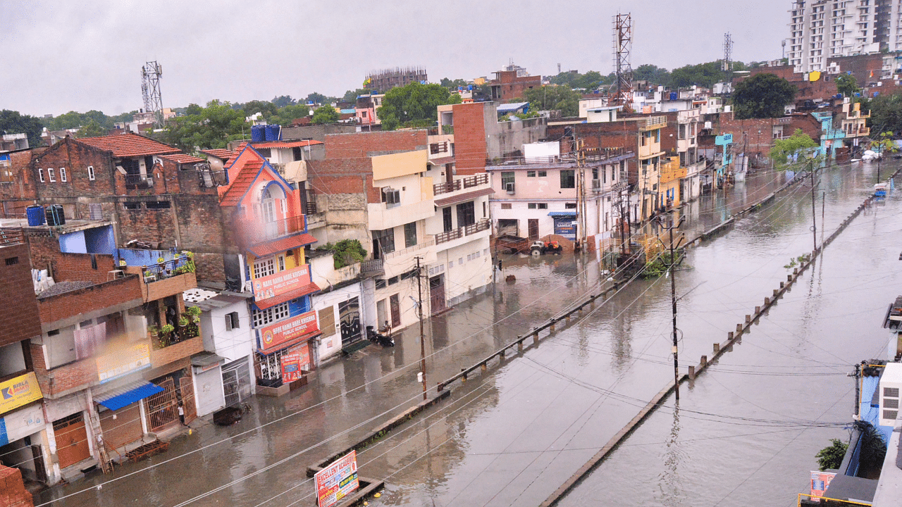 Flooded roads along the Tilak Nagar Sisamau drain following heavy downpour, in Kanpur. Credit: PTI Photo