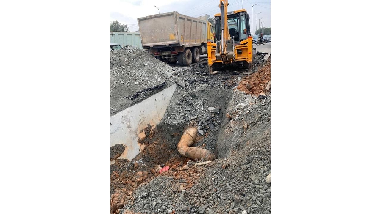 A portion of the service road situated near the newly built Kundalahalli underpass caved in last week. Civic authorities said continuous water leakage from a pipeline had caused the damage. Credit: Special Arrangement