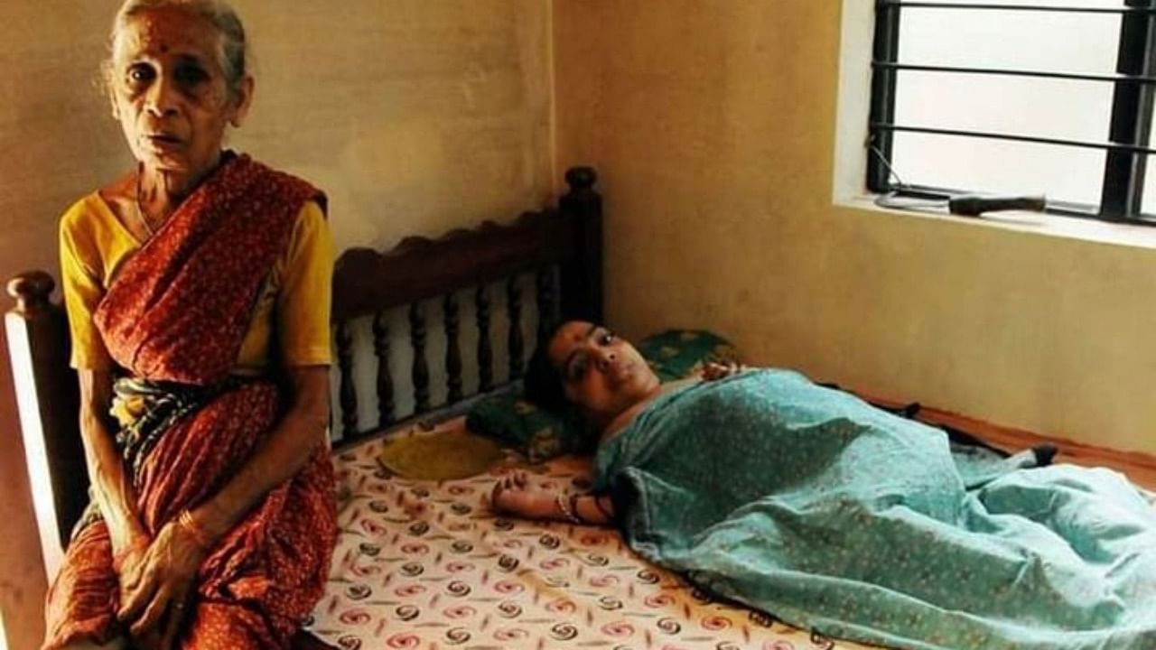 Devaki Rai with her bed-ridden endosulfan victim daughter Sheelavathi. Credit: Kunchacko Boban