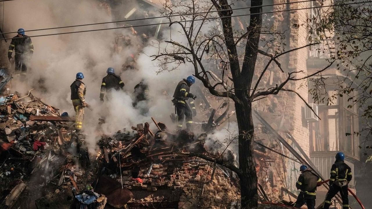 Ukrainian firefighters works on a destroyed building after a drone attack in Kyiv. Credit: AFP Photo