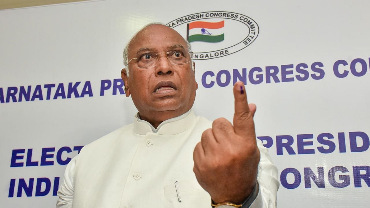 AICC Presidential candidate Mallikarjun Kharge shows his inked finger after casting his vote at the KPCC office, in Bengaluru. Credit: PTI Photo