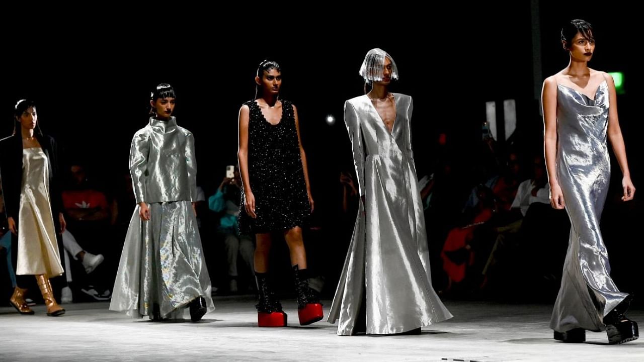Models present creations by designer Rajesh Pratap Singh at the FDCI X Lakme Fashion Week in Mumbai. Credit: AFP Photo