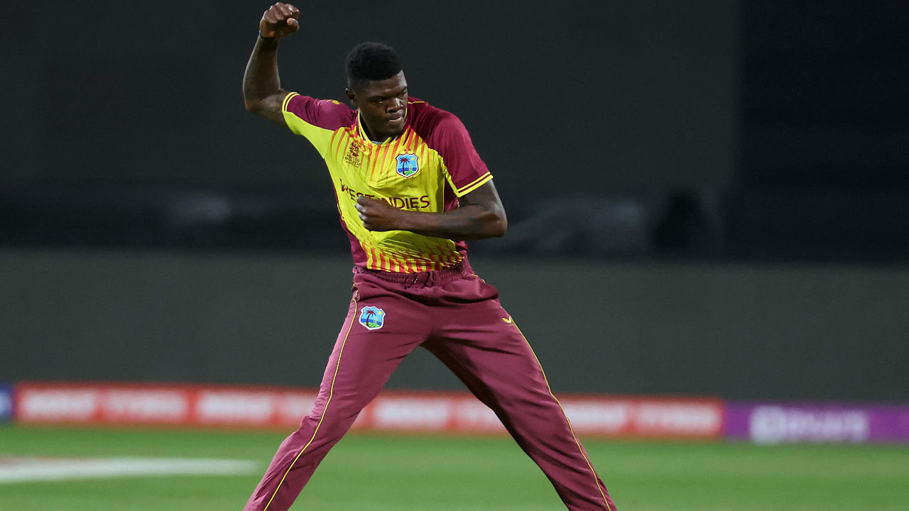 West Indies' Alzarri Joseph celebrates his wicket of Zimbabwe's Luke Jongwe during the ICC men’s Twenty20 World Cup 2022 cricket match between West Indies and Zimbabwe. Credit: AFP Photo