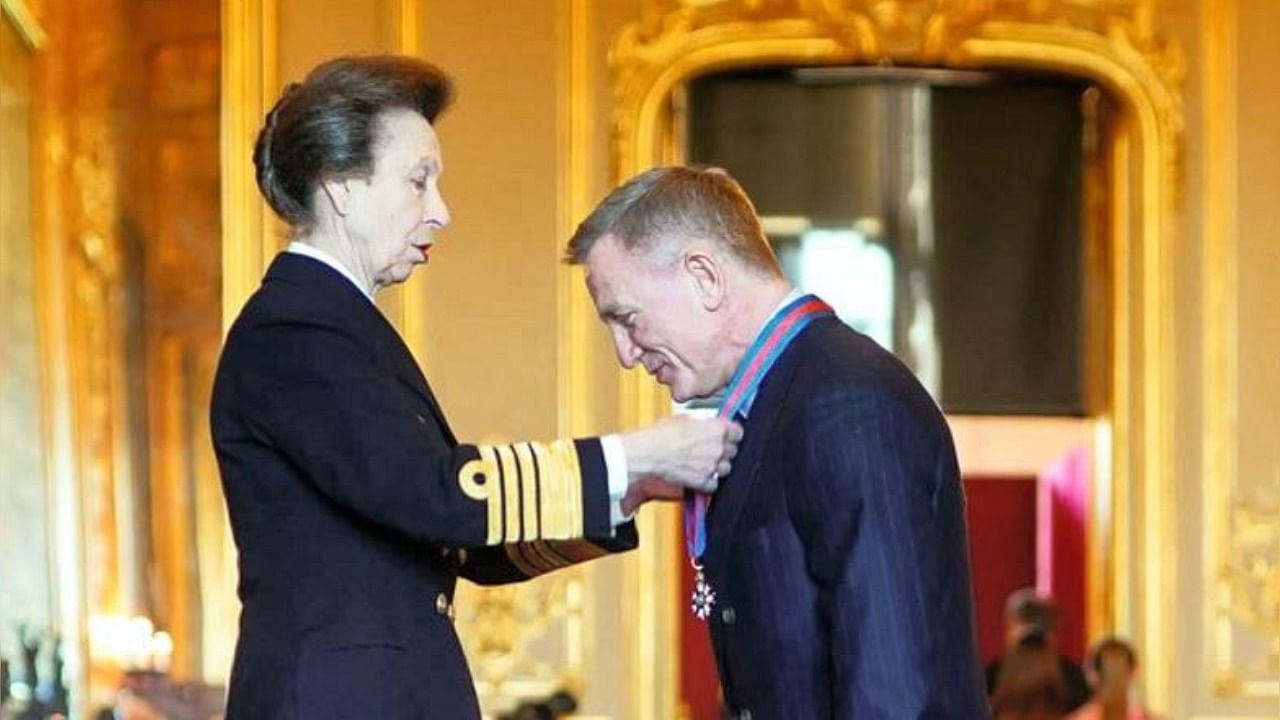 Princess Anne presents the Order of St Michael and St George to Daniel Craig. Credit: PTI Photo