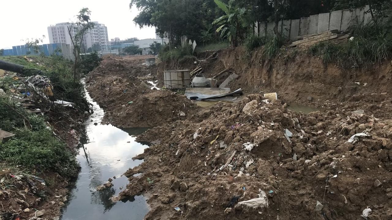 The SWD, nearly 30 ft wide, has turned into a dumping yard with a huge pile of mud covering a large portion of the drain. Credit: Special Arrangement