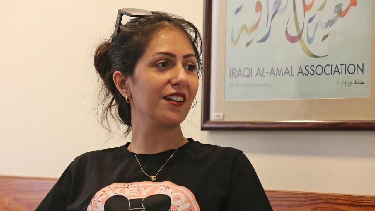 Manal Jabbar, a 33-year-old Iraqi woman who was divorced eight years prior, gives an interview with AFP in Baghdad on September 18, 2022. - In Iraq, more than 73,000 divorces were pronounced in 2021 by the courts in the country of 42 million people, largely the same as the number in 2018. Credit: AFP Photo