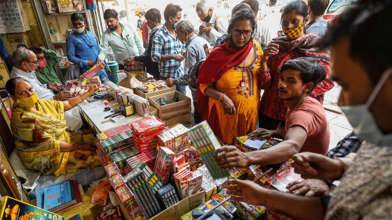 People visit a firecrackers' shop near Jama Masjid in old Delhi. Credit: PTI Photo