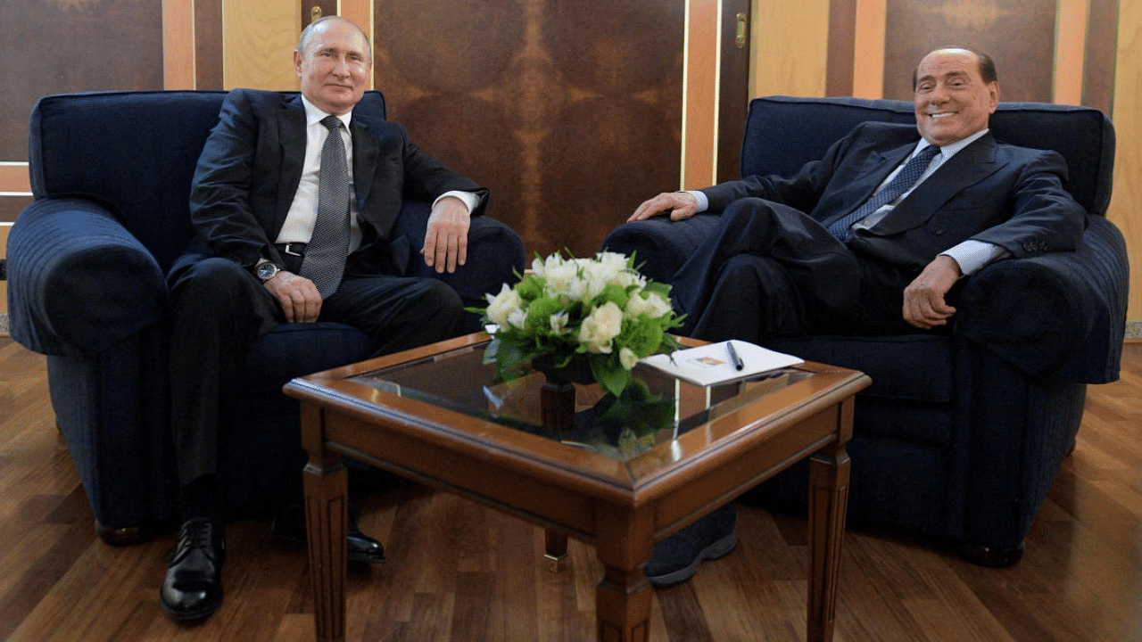 Russsian president Vladimir Putin meets with Italian Member of the European Parliament Silvio Berlusconi. Credit: Reuters Photo