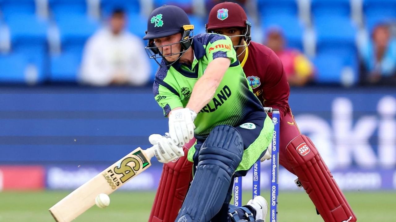 Ireland's Lorcan Tucker (L) plays a shot watched by the West Indies' wicketkeeper Nicholas Pooran during the ICC men’s Twenty20 World Cup 2022 cricket match between West Indies and Ireland at Bellerive Oval in Hobart on October 21, 2022. Credit: AFP Photo