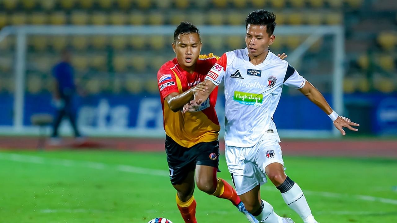 Northeast United FC (in white) and East Bengal vie for the ball during the Indian Super League (ISL) 2022-23 football match, at Indira Gandhi Athletic Stadium in Guwahati. Credit: PTI Photo