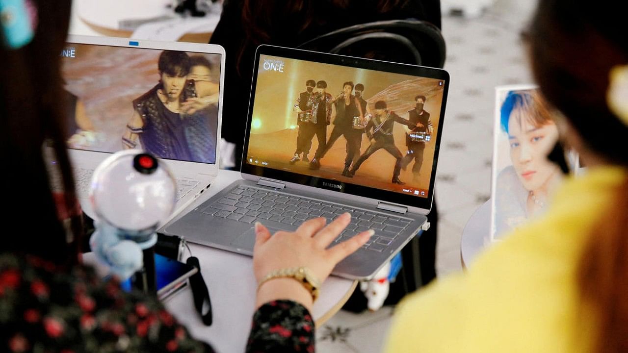 Fans of K-pop idol boy band BTS watch a live streaming online concert. Credit: Reuters File Photo