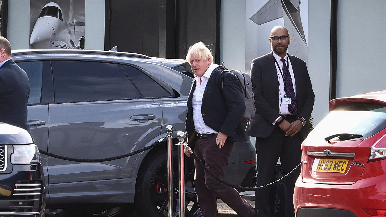 Former British Prime Minister Boris Johnson walks, at Gatwick Airport, near London, Britain October 22, 2022. Credit: Reuters Photo