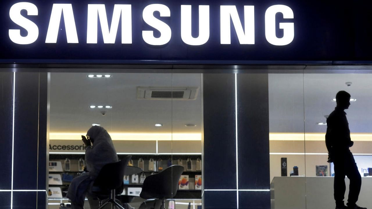 Customers inside a Samsung showroom in New Delhi. Credit: Reuters Photo