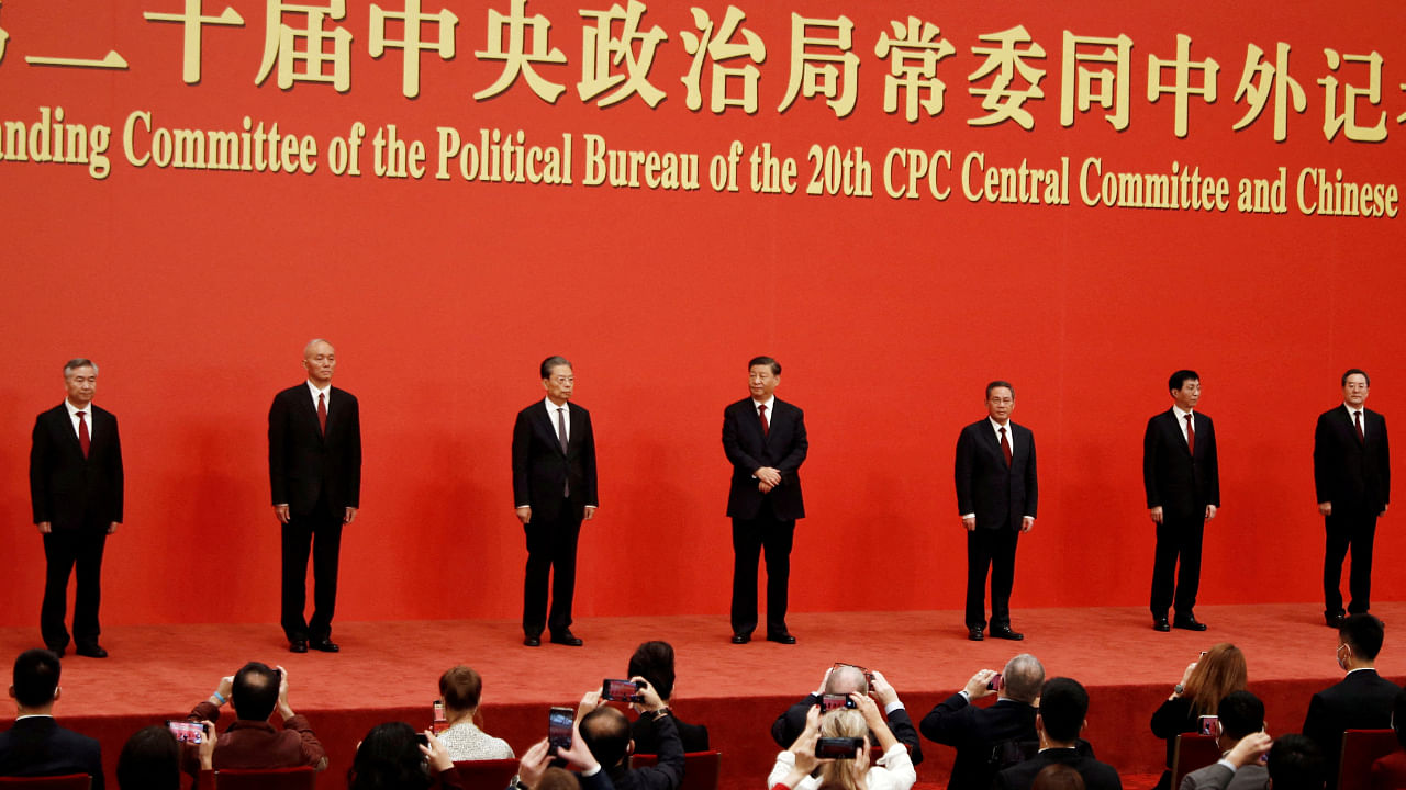 Xi Jinping with the new members of the Politburo Standing Committee. Credit: Reuters Photo