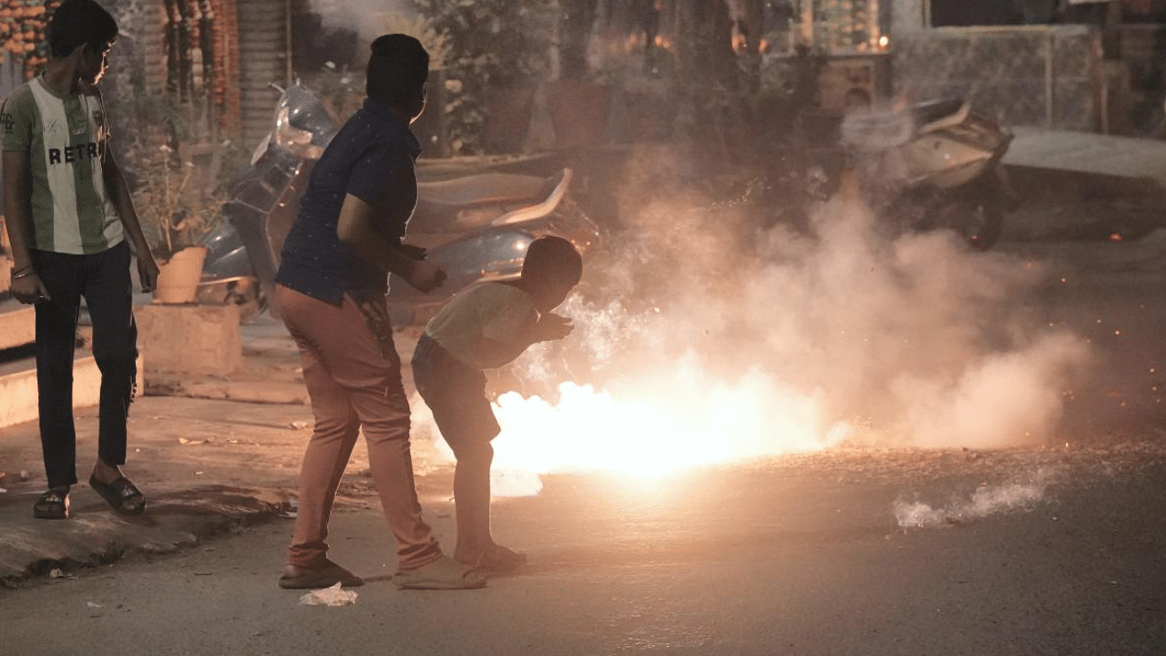 Children burst firecrackers on Diwali, flouting the ban imposed on it by the Delhi Government. Credit: PTI Photo