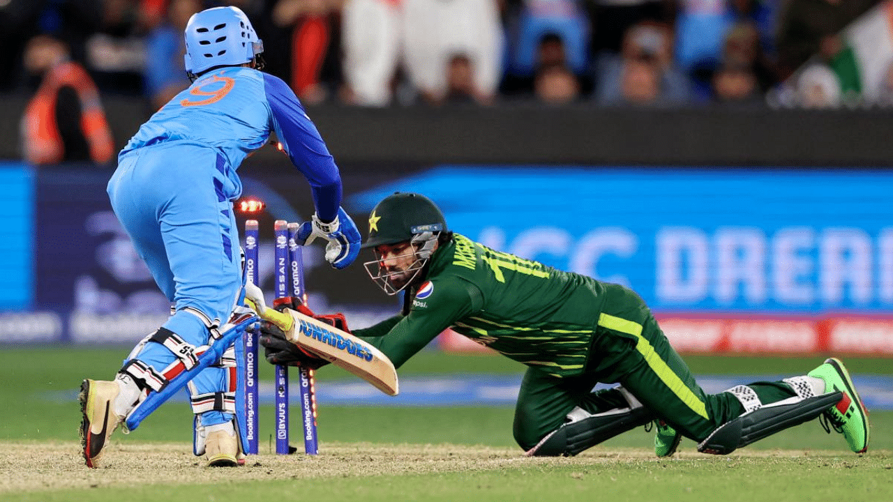 India's Dinesh Karthik is stumped by Pakistan's Mohammad Rizwan during the ICC men's Twenty20 World Cup match. Credit: AFP Photo