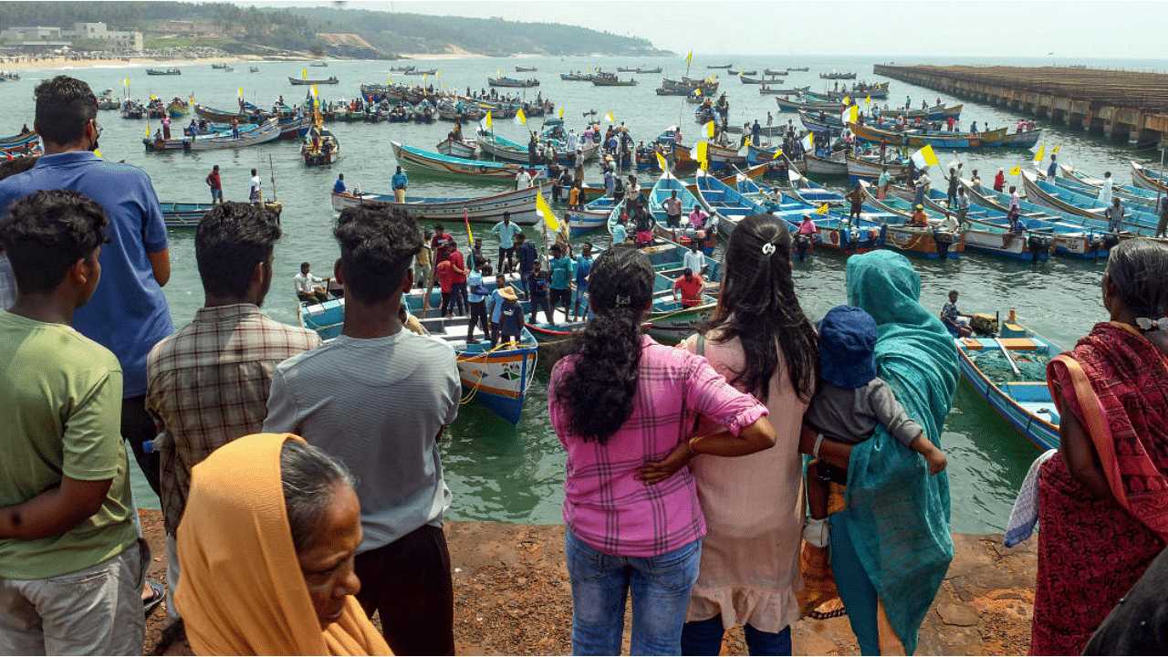 Fishers and citizens using their fishing boats lay siege to Adani port during their protest against Adani Group's port development project at Vizhinjam. Credit: PTI Photo