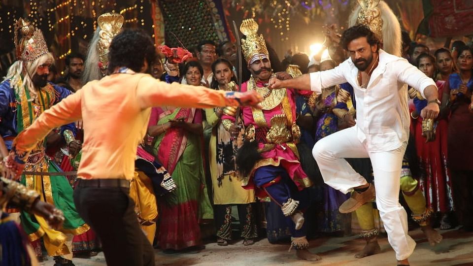 This scene in the film spurred a controversy. One section of people were upset that the Veeragase dancers, present during the Karaga festival, were not in the right costume and insulted the tradition by wearing shoes. Credit: Screengrab from the movie