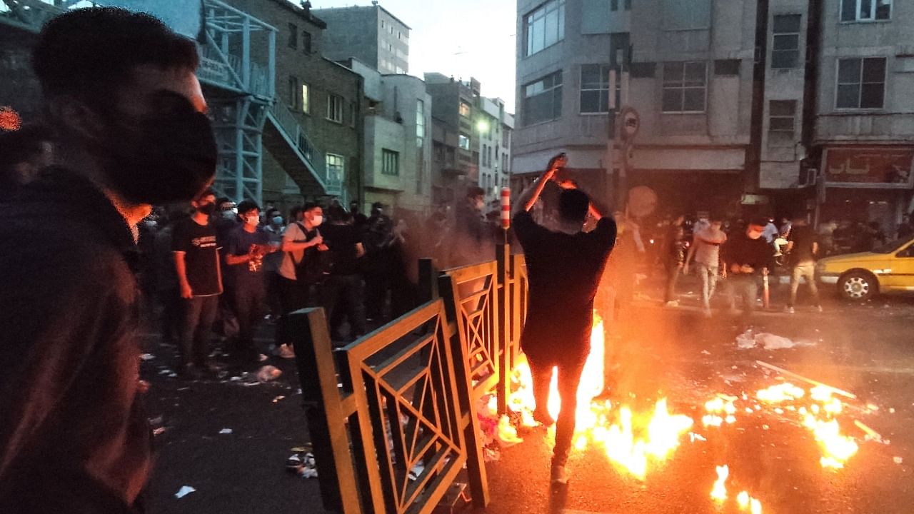 Videos on social media showed confrontations between students and riot police and Basij forces in universities all over Iran. Credit: AFP File Photo