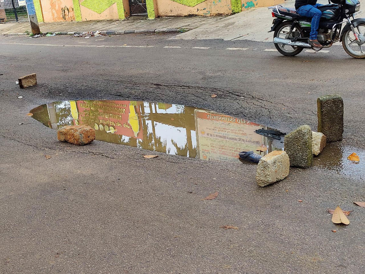 The pothole which is suspected to have caused the accident. Credit: DH Photo