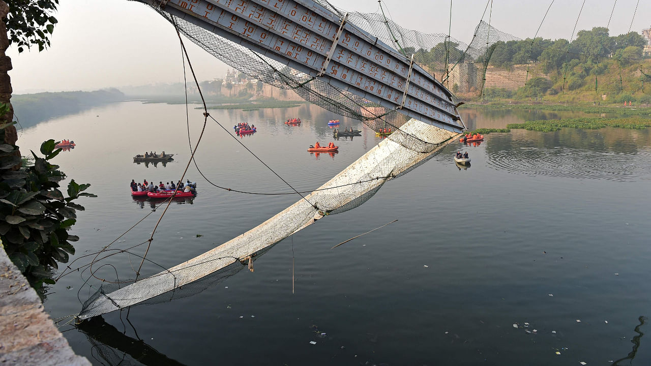 Rescue personnel conduct search operations after a bridge across the river Machchhu collapsed at Morbi in Gujarat state on October 31, 2022. Credit: AFP Photo