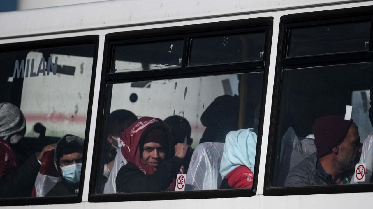 File photo of migrants being taken on a bus from Dover port in England to a processing centre. Credit: AFP Photo