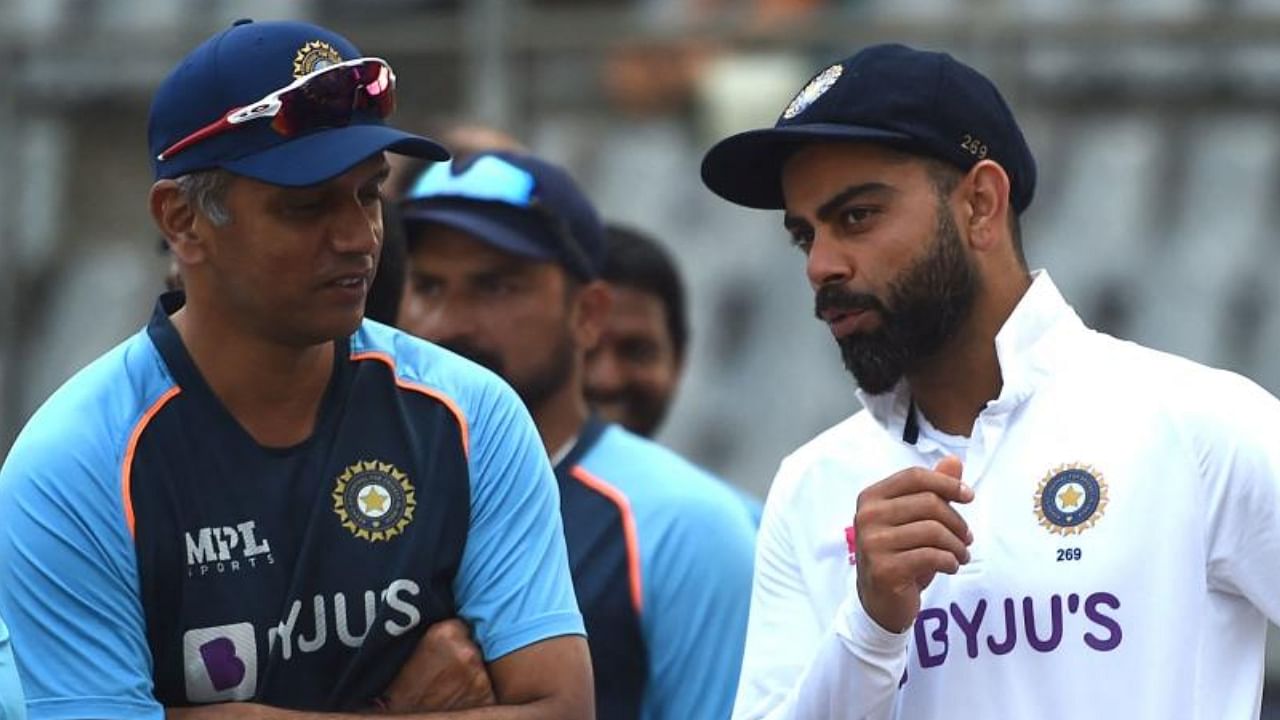 Virat Kohli and coach Rahul Dravid. Credit: AFP File Photo