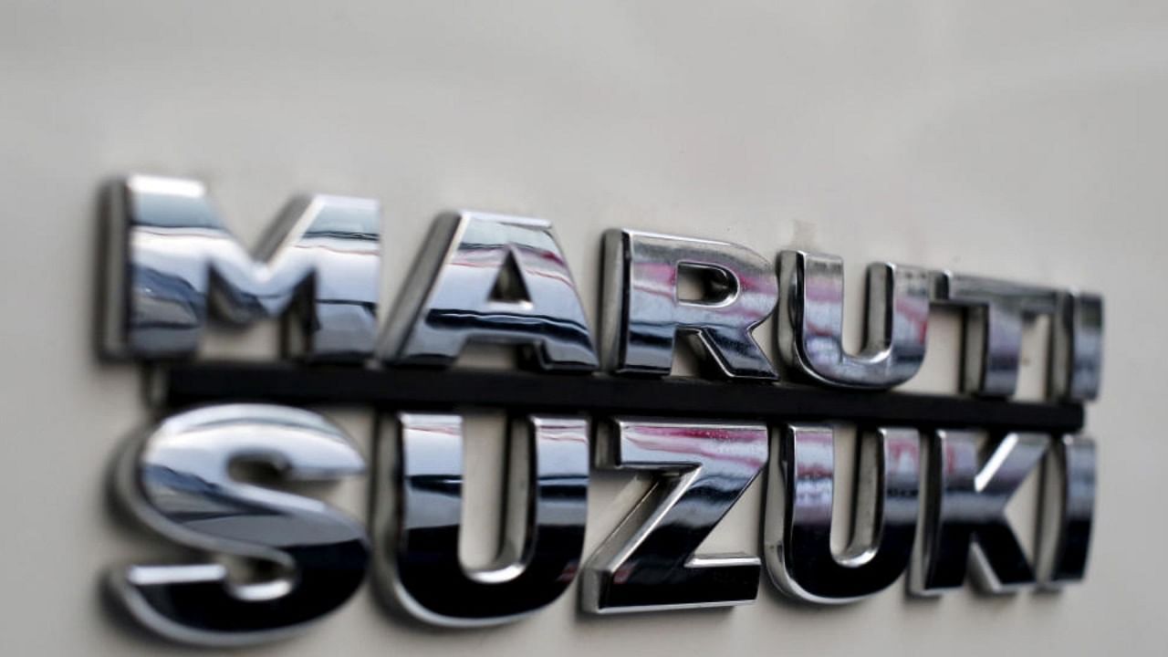 The logo of Maruti Suzuki India Limited is pictured on a car parked outside a showroom in New Delhi. Credit: PTI Photo