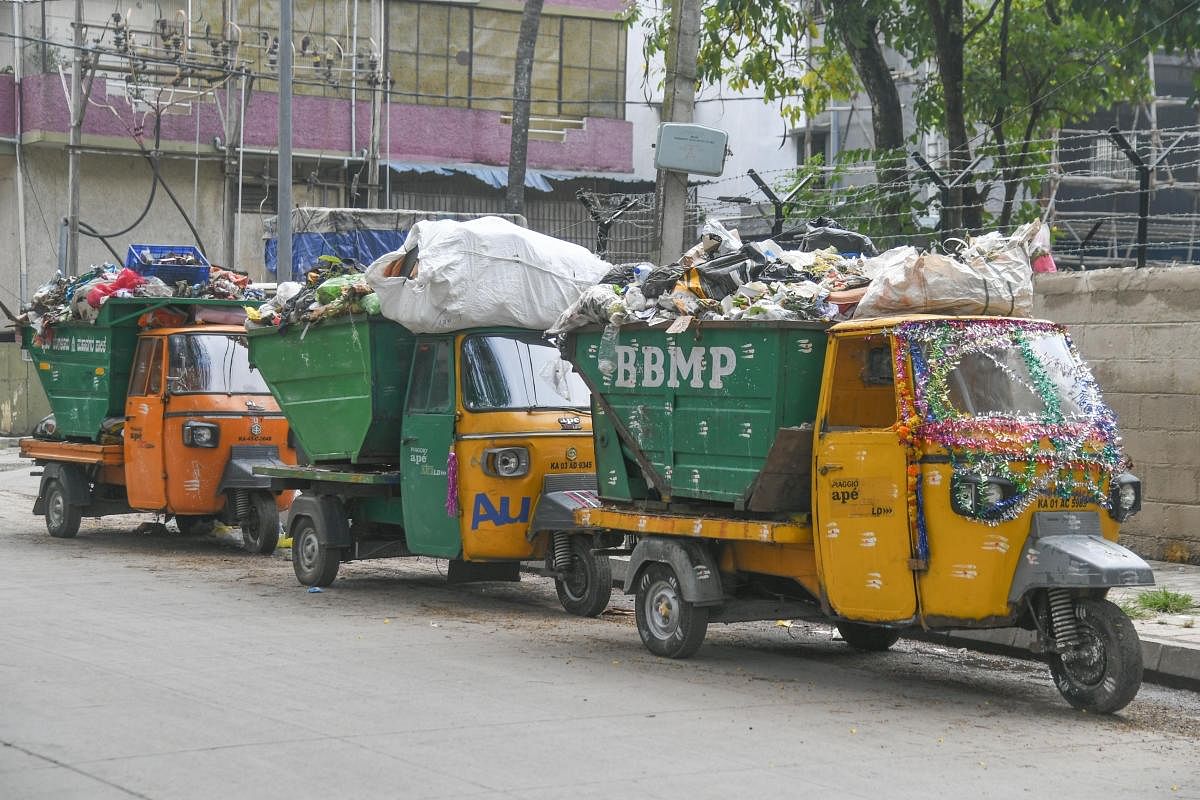 The BBMP's garbage collection vehicles at BTS Road, Wilson Garden. DH Photo/S K Dinesh