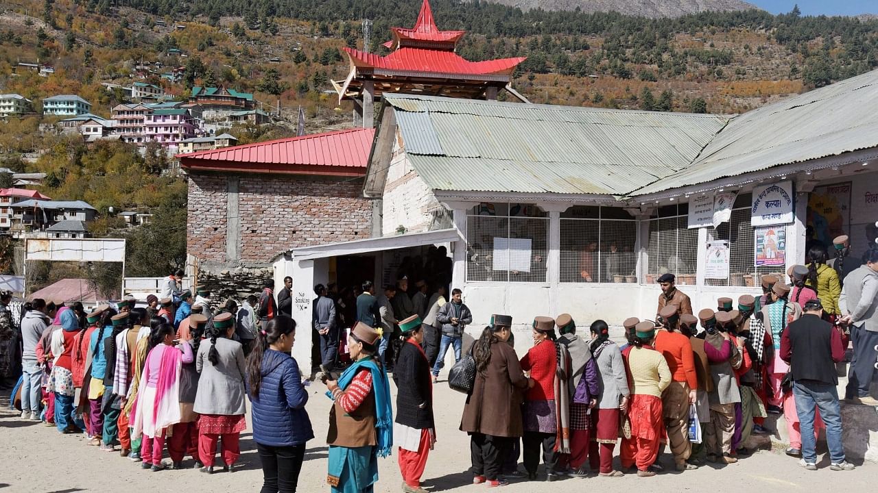 Voters standing in a queue to cast their votes at a polling both during the state's Assembly elections, in Khwangi village distt. Kinnaur, Himachal Pradesh, November 9, 2017. Credit: PTI File Photo