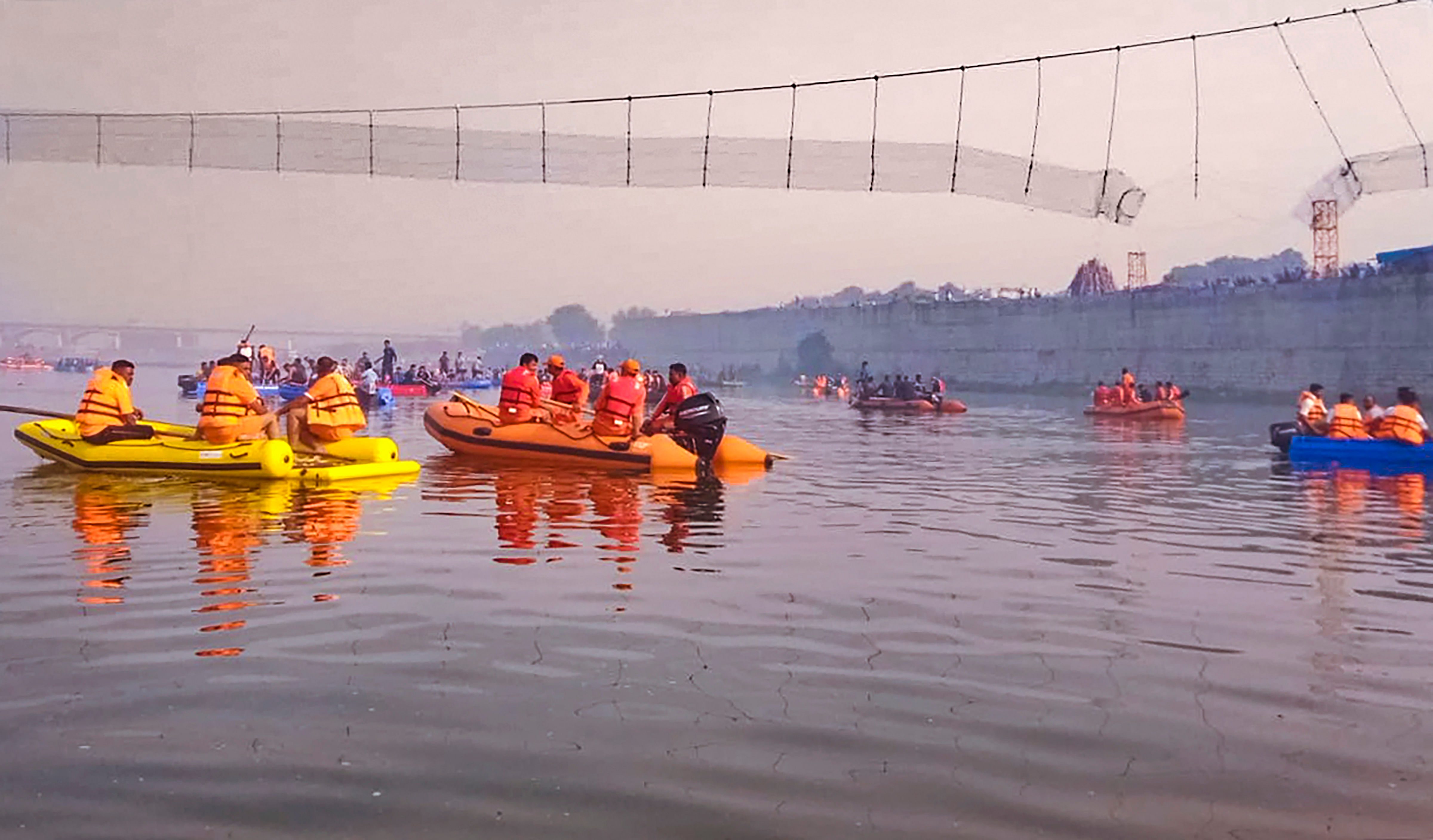 <div class="paragraphs"><p>National Disaster Response Force personnel during a rescue operation after the collapse of a suspension bridge over the Machchhu river, in Morbi district. </p></div>